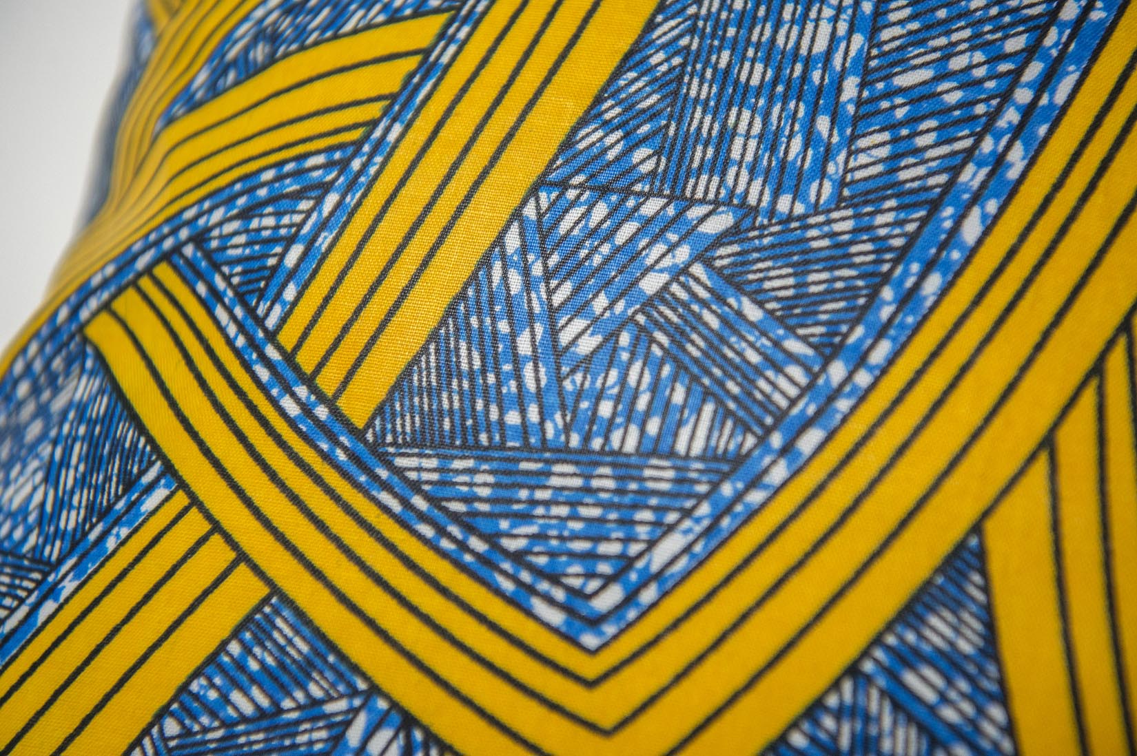 Amari Africa wax throw indigo and yellow cushion - Natalia Willmott