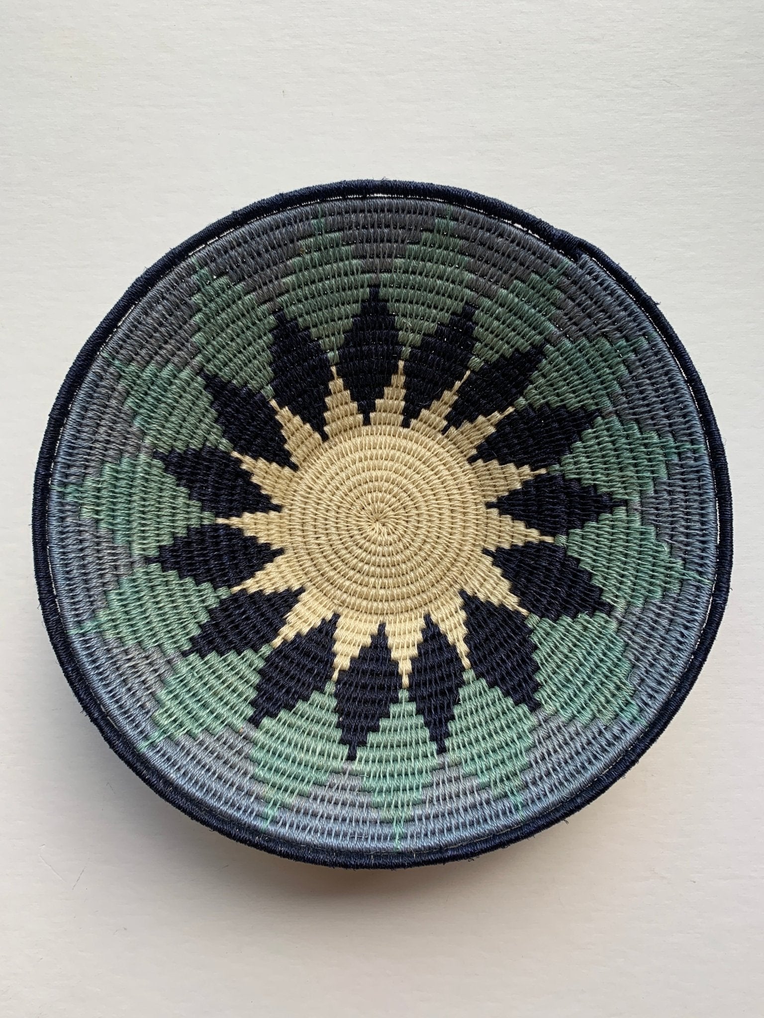 Hand woven sisal basket plate - sunburst blue - Natalia Willmott