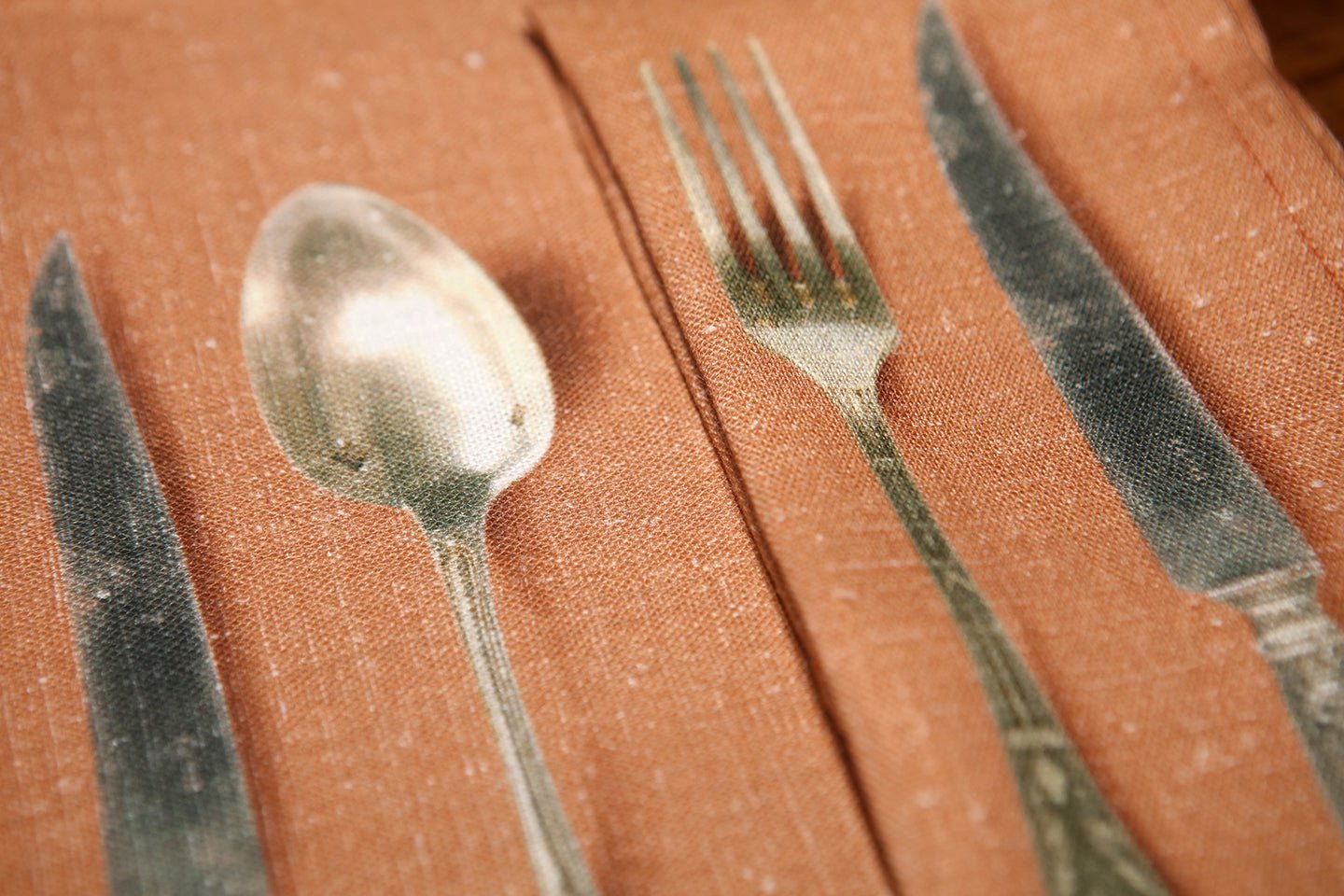 Pair of napkins and Pair of place mats printed with image of antique spoon, fork and knife - Natalia Willmott