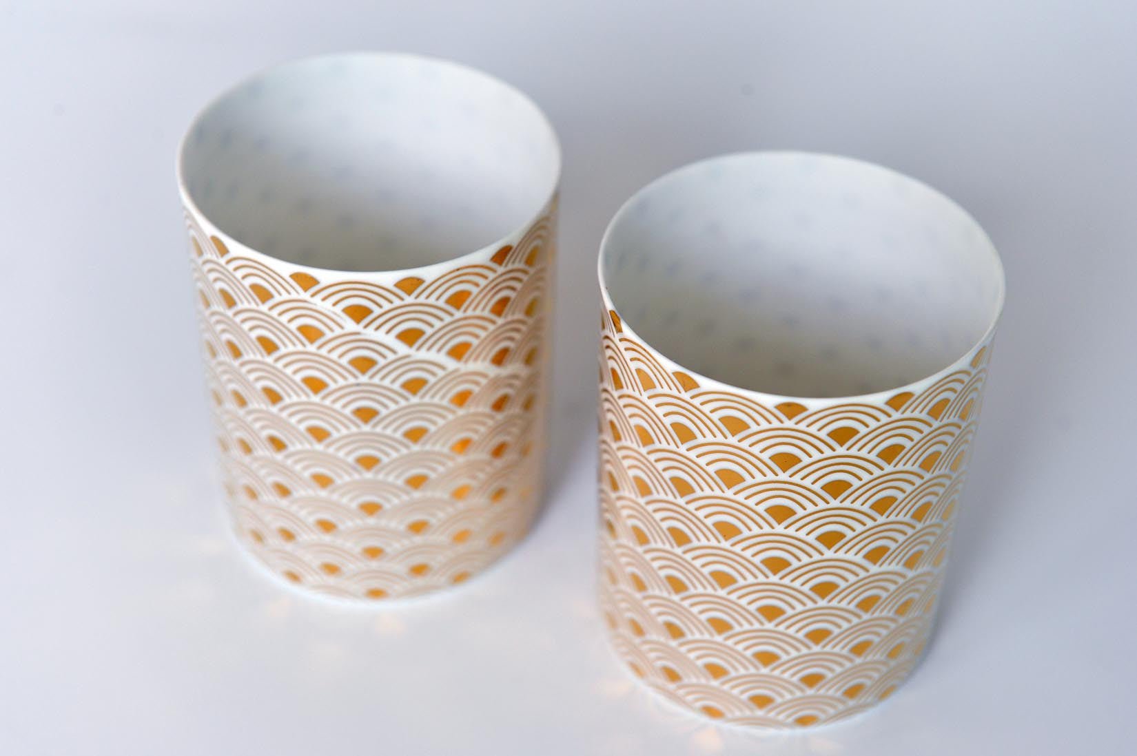Porcelain votive with a gold rainbow design - Natalia Willmott