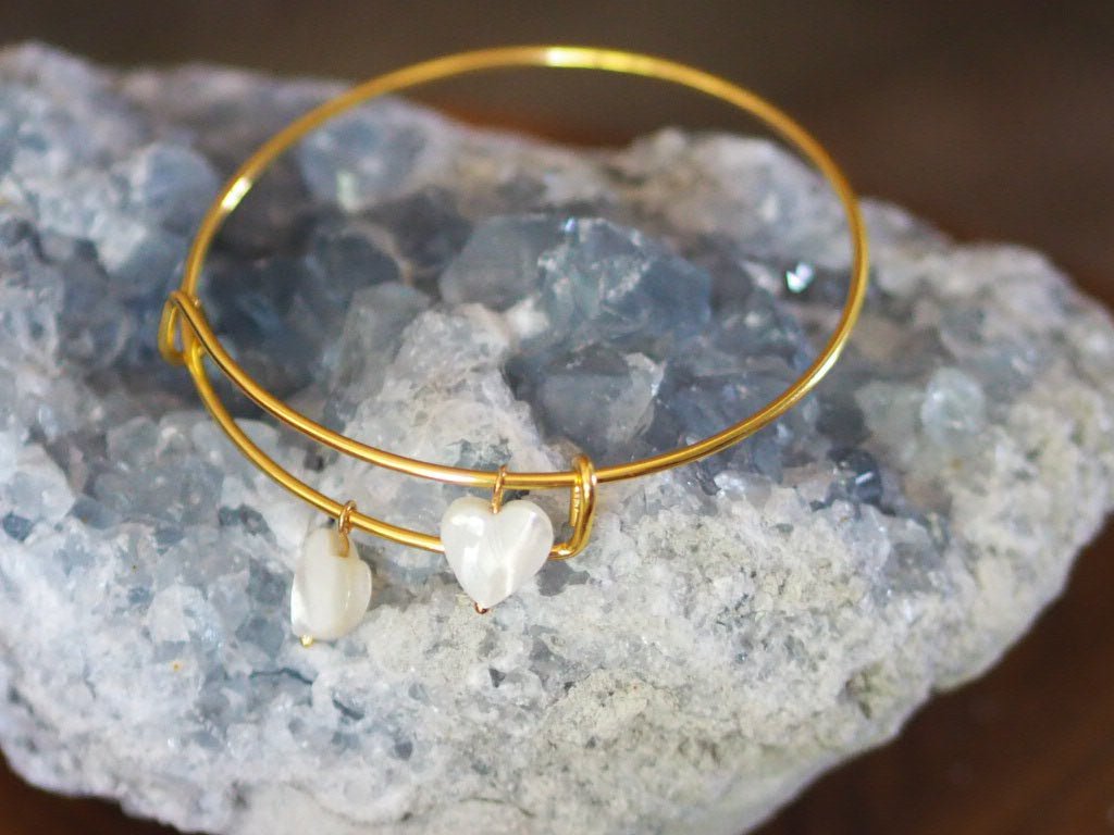 Gold plated bangle with two mother of pearl hearts - Natalia Willmott