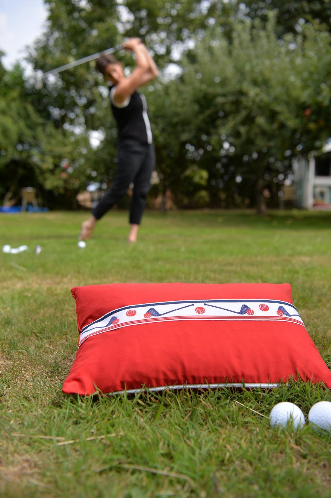 "Golf" Ruby red silk cushion - Natalia Willmott