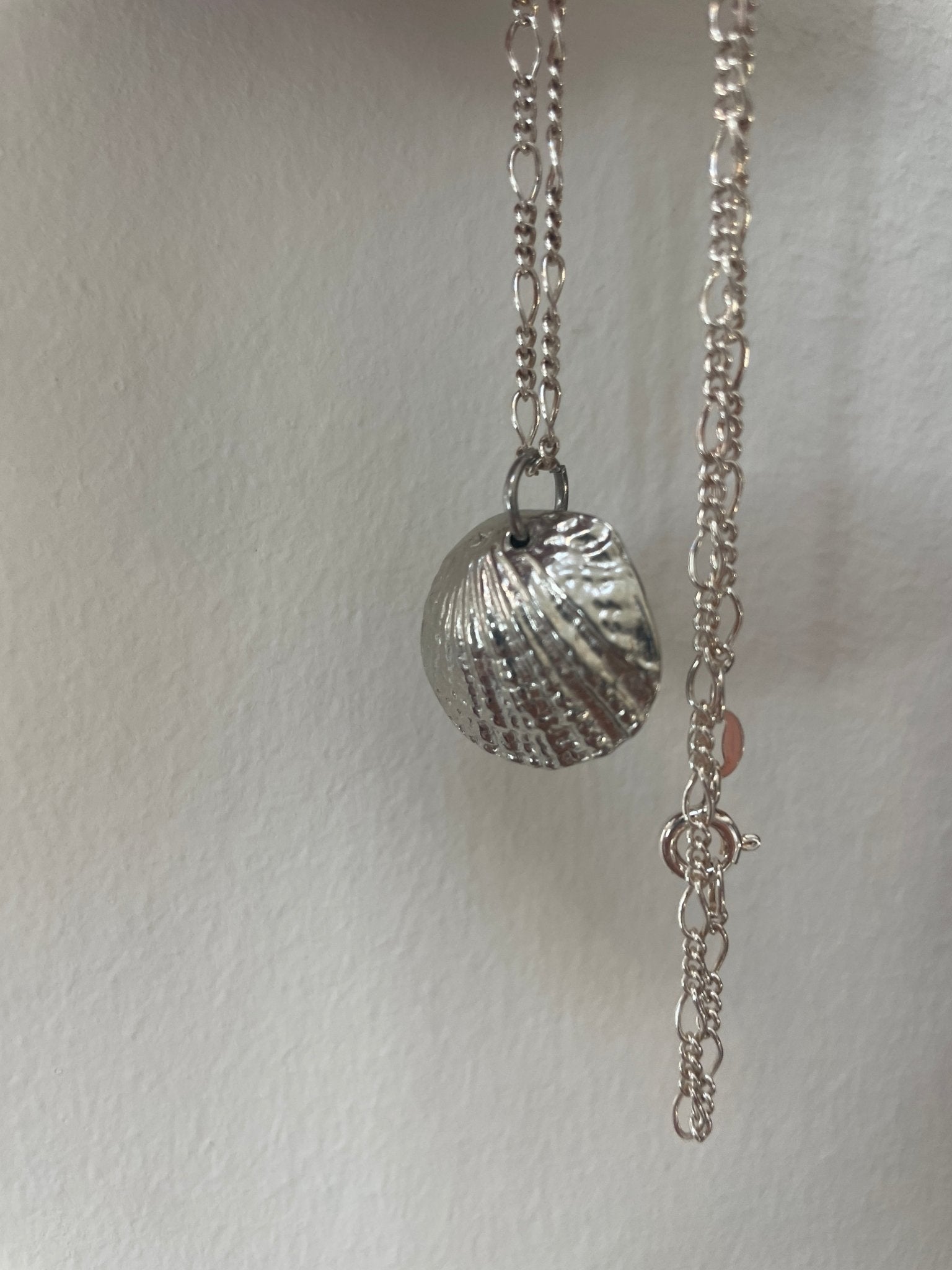 Handmade pewter scallop shell necklace with hidden ivory pearl - Natalia Willmott