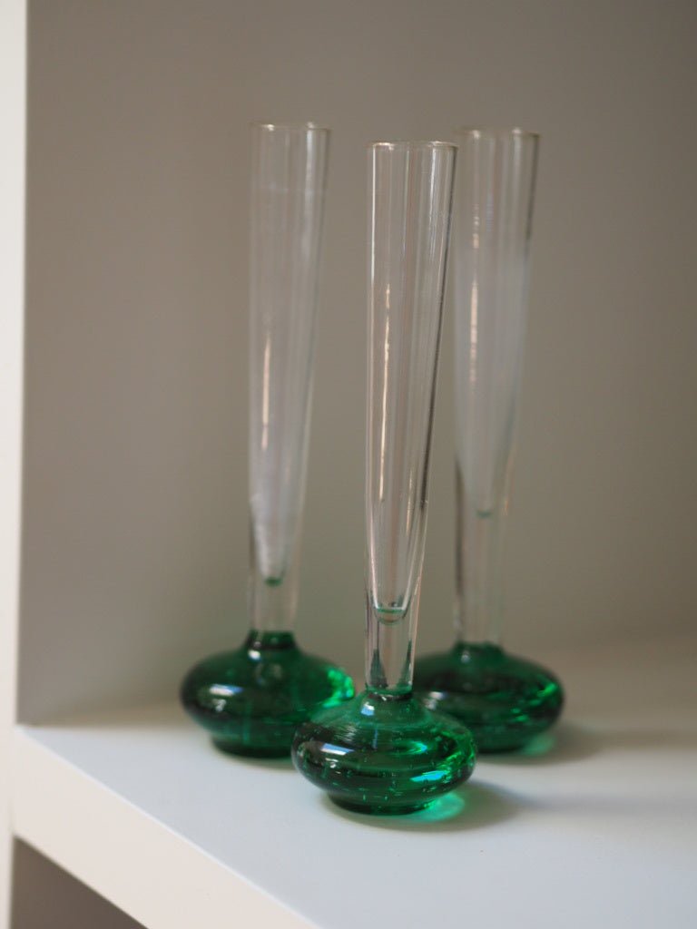 Set of 7 mid century green bud glass vases - Natalia Willmott