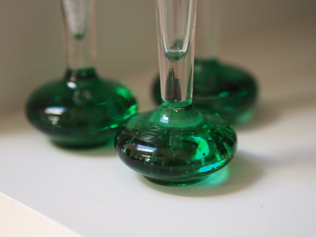 Set of 7 mid century green bud glass vases - Natalia Willmott