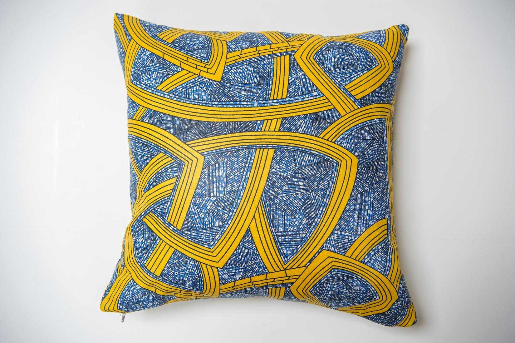 Amari Africa wax throw indigo and yellow cushion - Natalia Willmott