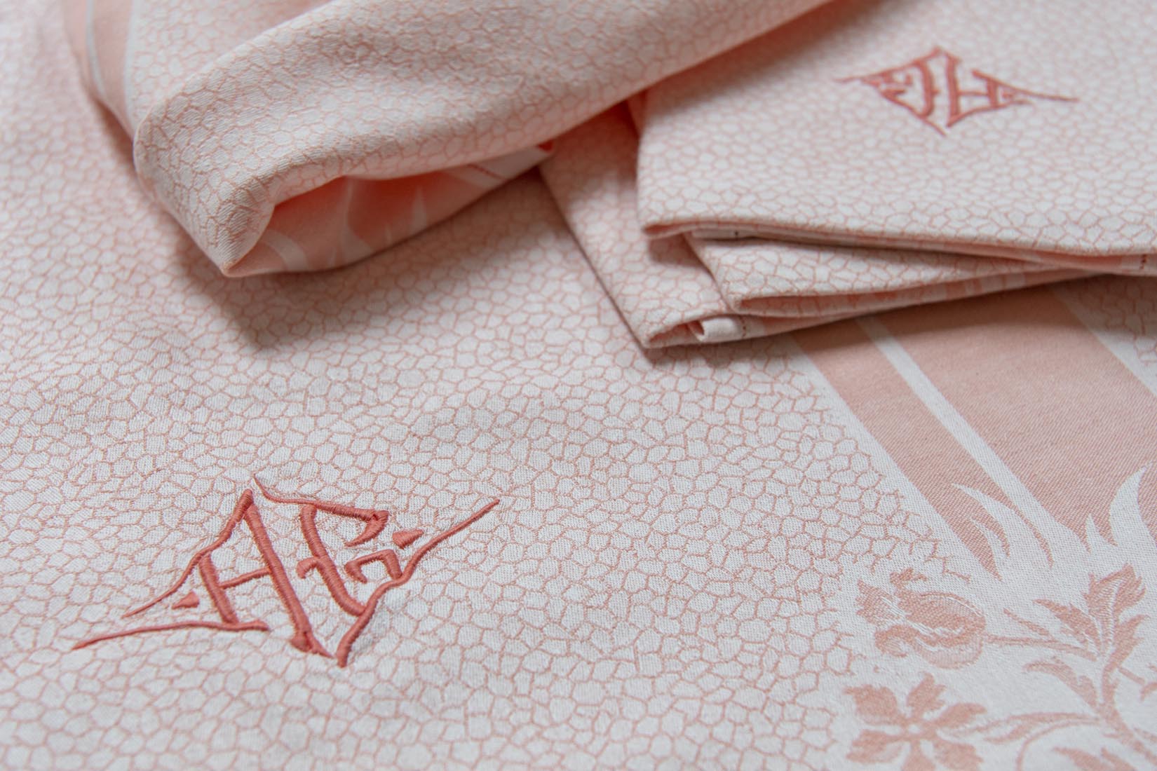 Coral pink damask tablecloth and napkins with double letter monogram AG - Natalia Willmott